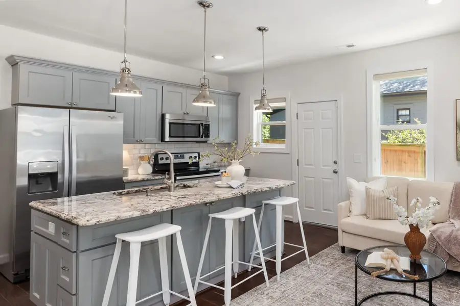 Illustrative photo of a modern kitchen with pendant lights. Not a Complete Electrical lighting job.